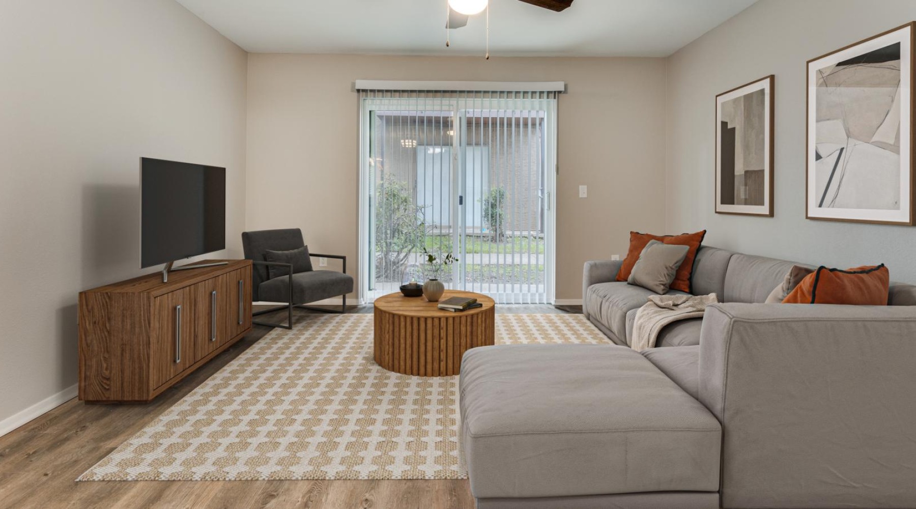 a living room with a couch and a table and a tv