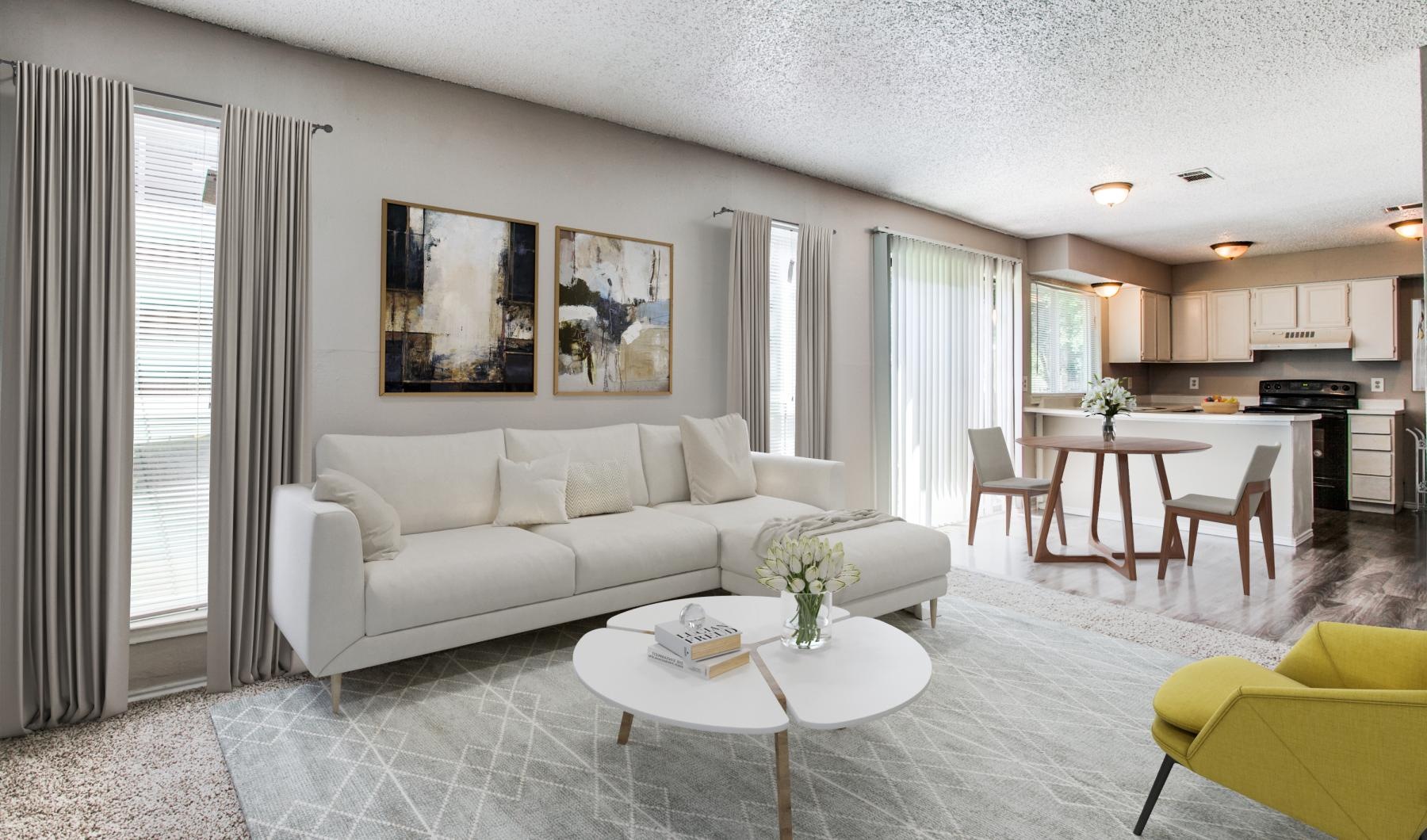 a living room with a white couch and a table